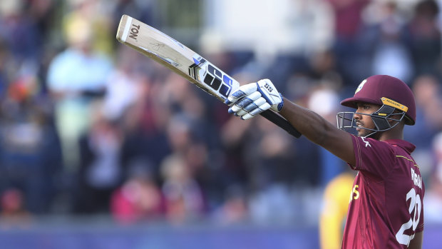 Ton of fun: West Indies' batsman Nicholas Pooran salutes after raising his century.