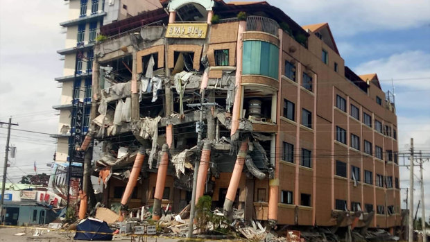 Eva's Hotel stands damaged after a strong earthquake in Kidapawan, Philippines, on Thursday.