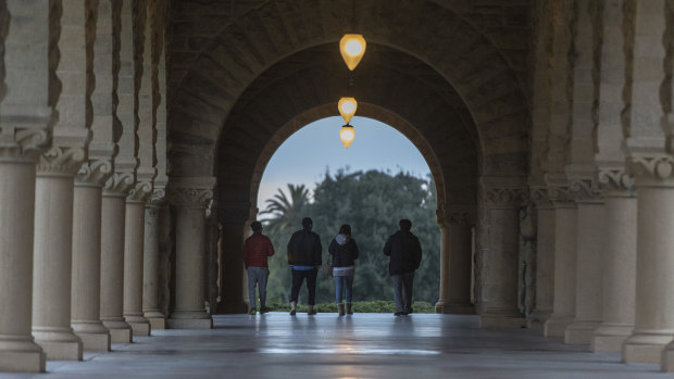 Students walk along the Serra Mall on the campus of California's Stanford University, one of the US tertiary institutions linked to the scam.