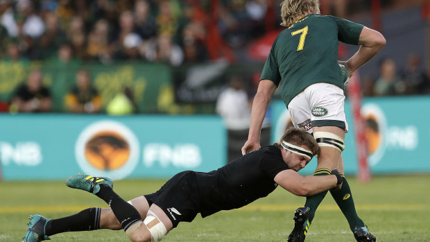 Sidelined: New Zealand's Sam Cane, tackles South Africa's Pieter-Steph du Toit during the Rugby Championship match in Pretoria.