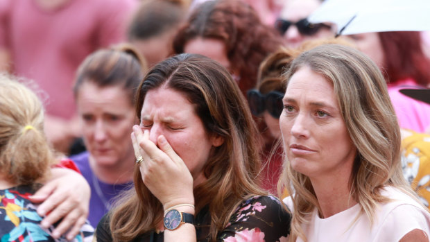 A woman in the crowd sheds a tear at the vigil for Hannah Clarke and her three children Aaliyah, 6, Laianah, 4, and Trey, 3.