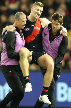 Shaun McKernan is carried from the ground.