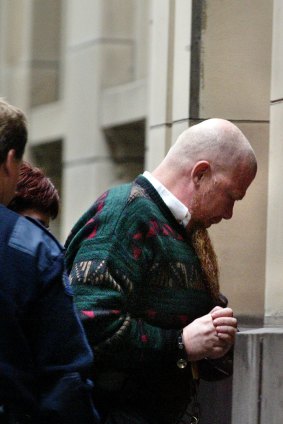 Gregory Brazel is escorted into the Supreme Court, March 2003. He appeared for sentencing having admitted to the 1982 murder of Mildred Hanmer.