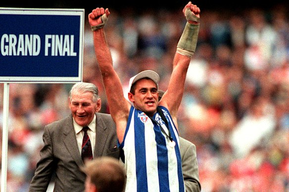 Wayne Schwass celebrating the 1996 AFL premiership, hiding the mental health issues he would later admit he was fighting at the time.