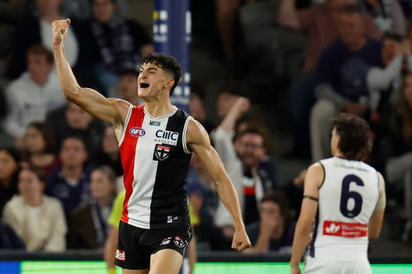 First-gamer Anthony Caminiti celebrates as St Kilda storm to a win over Fremantle at Marvel Stadium.