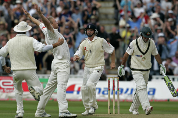 England's Andrew Flintoff celebrates with captain Michael Vaughan, far left, and Ian Bell, third left, after taking the wicket of Australia captain Ricky Ponting at Edgbaston, 2005.