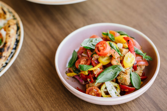 Panzanella salad with tomatoes, basil, croutons, chilli, red onion and roasted peppers. 