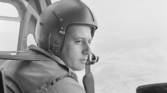 Flight Lieutenant Bob Grandin at the controls of an RAAF Iroquois helicopter while flying the run from the Australian Army at Task Force Headquarters at Nui Dat to the Vung Tau airfield during the Vietnam War. 