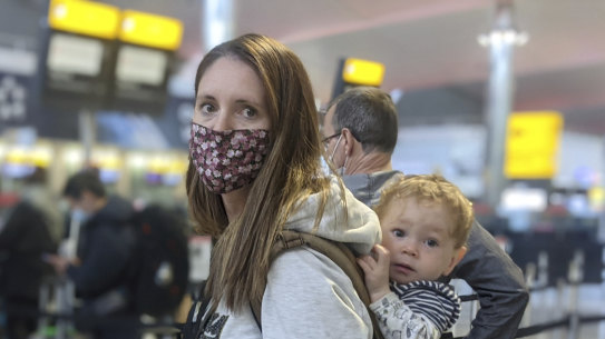 Prue O'Donnell, (24) checks in for repatriation flight QF110 at London's Heathrow Airport.