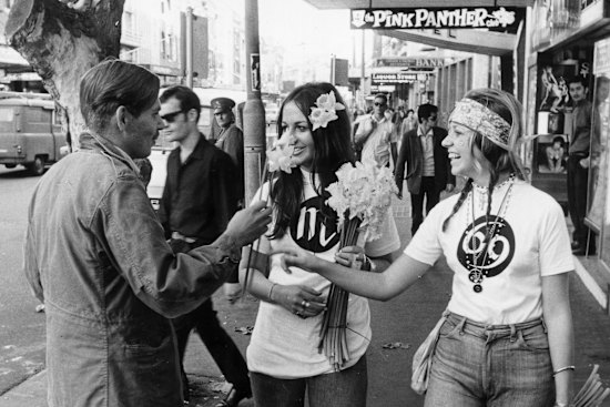 Peace, love and “flower power” was the mantra of the hippie generation: handing out daffodils to Kings Cross pedestrians in 1969.