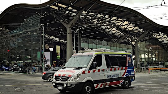 An ambulance travels through Melbourne’s CBD.