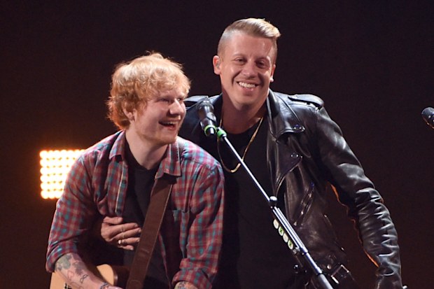 Singer/songwriter Ed Sheeran (L) and rapper Macklemore perform onstage during the 2014 iHeartRadio Music Festival at the MGM Grand Garden Arena on September 20, 2014 in Las Vegas, Nevada