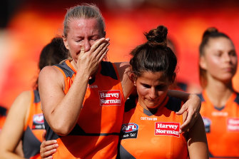 Heartbreak: Tanya Hetherington with her Giants teammates after their last-gasp loss at Giants Stadium.