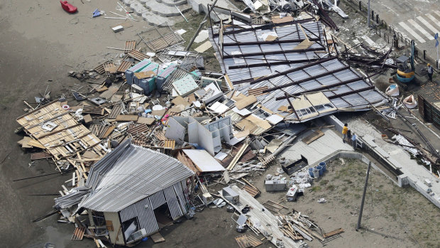 Houses were destroyed at the beachfront area of Miura, south of Tokyo.