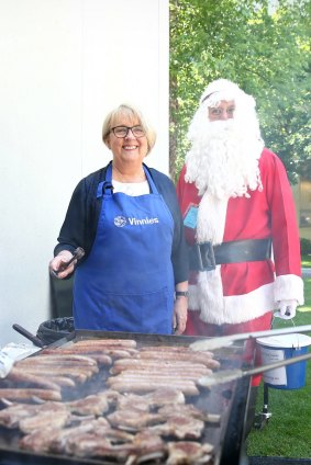 Jenny Macklin with Father Christmas at her annual fundraiser barbeque for the St Vincent De Paul Society.