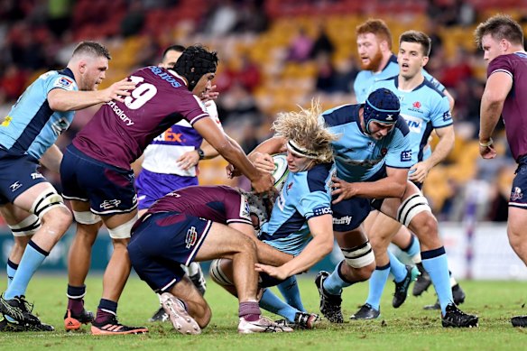 Ned Hanigan is tackled during Friday night's match.