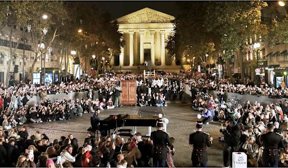 Crowds enjoy Carol of the Bells in Paris. Videos of the performance have gone viral.