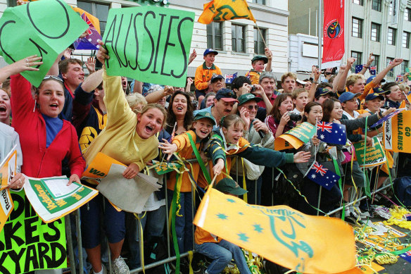 Wallabies supporters celebrate at Sydney's Town Hall during a tickertape parade for the world champion on November 17, 1999.