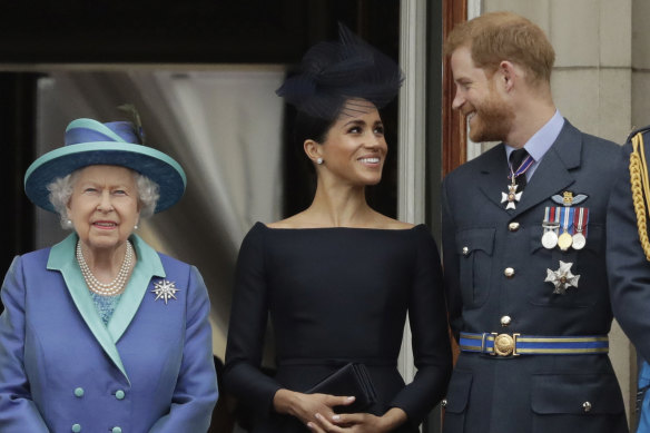 Queen Elizabeth II, with Meghan and Prrince Harry in 2018.