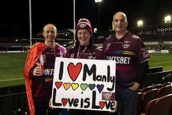 Manly supporters Garry Moore, Angela Martinez and Didier Rivet at 4 Pines Park. Photo: Rhett Wyman/SMH