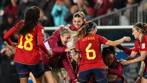Spanish players celebrate victory in Auckland.