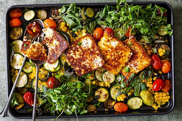 Summer on a tray: roasted seasonal veg topped with slabs of halloumi.