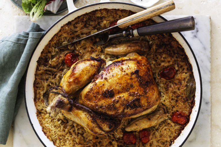 ***EMBARGOED FOR GOOD WEEKEND, AUGUST 15/20 ISSUE***
Karen Martini recipe : Roast chicken on baked rice with tomato, cumin &amp; bay
Photograph by William Meppem (photographer on contract, no restrictions)Â 