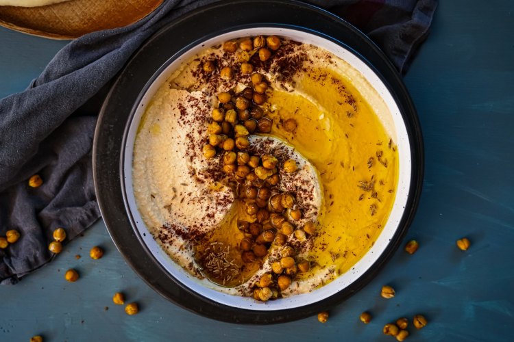 Preserved lemon hummus with cumin and sumac roasted chickpeas. Ottolenghi inspired mix and match Middle Eastern share friendly feast recipes for Good Food, October 2019. Images and recipes by KatrinaÂ Meynink. Good Food use only.