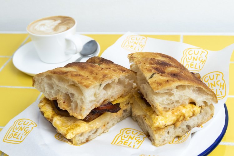 Cut Lunch Deli. Bacon, egg and cheese focaccia with chilli oil mayo. Randwick, August 23, 2022. Photo: Rhett Wyman/SMH .