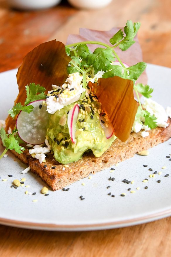 Avocado open sandwich smorrebrod with vegemite shard.