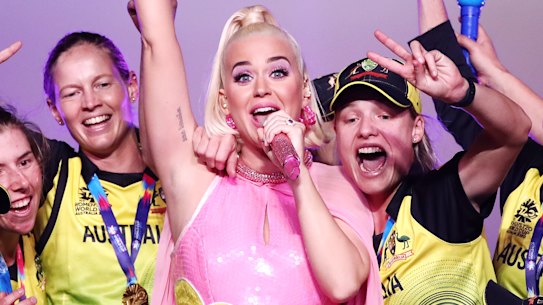 Katy Perry with the triumphant Australian team after they won the T20 World Cup final at the MCG.