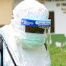 Health workers prepare disinfection at a Congolese treatment centre.