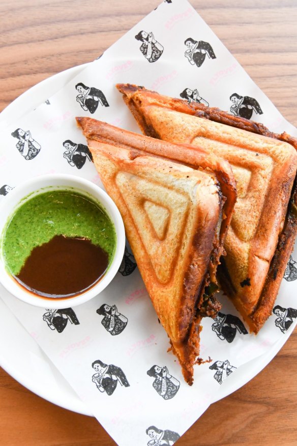 Tofu tikka jaffle with mint and tamarind chutney on the side.