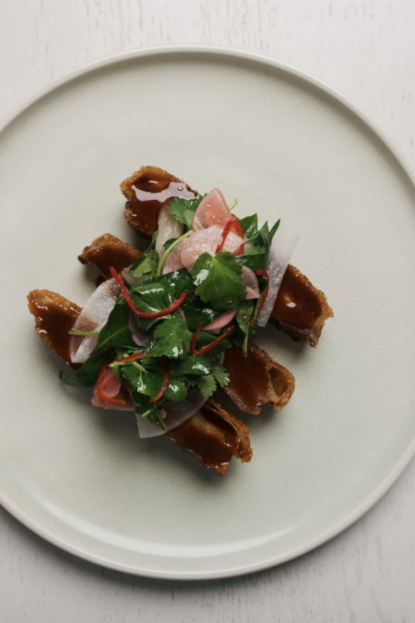 Crispy pork jowl, soy, ginger, pickled pineapple.