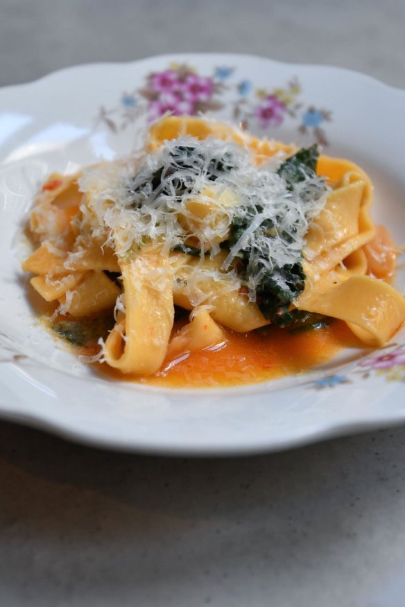 Fettuccine with wilted greens and chilli.