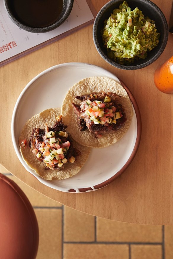 Slow-roasted lamb tacos with zucchini pico de gallo.