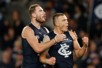 On song: Carlton’s Harry McKay, left, and Patrick Cripps celebrate. 