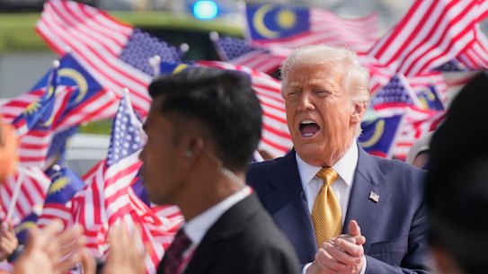 Donald Trump prepares to board Air Force One at Kuala Lumpur International Airport in Sepang, Malaysia, as he departs for Japan on Monday.