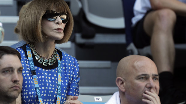 Power play ... Anna Wintour watches the Australian Open behind tennis legend Andre Agassi on Sunday.