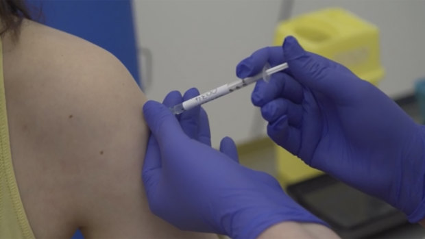 A person is injected as part of the first human trials in the UK to test a potential coronavirus vaccine.