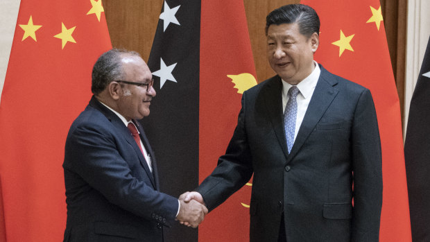PNG leader Peter O'Neill meets China's President Xi Jinping in Beijing earlier this year.