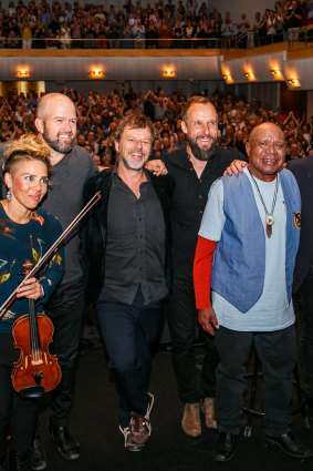 Archie Roach with band members after their show.