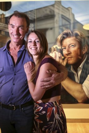 Winner of the 2019 Archibald Packing Room Prize, artist Tessa MacKay, poses with head packing room judge Brett Cuthbertson for a portrait with the media in front of her painting of actor David Wenham at the Art Gallery of NSW.