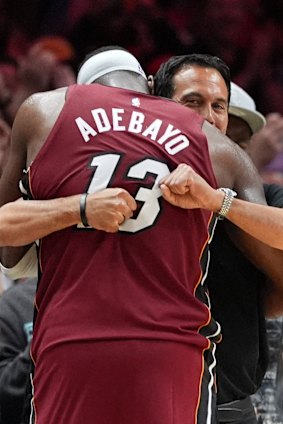 Miami Heat coach Erik Spoelstra hugs Adebayo after his astonishing game.