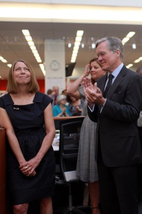 Bill Keller, then executive editor of The New York Times, acknowledges his successor, Jill Abramson in June, 2011.
