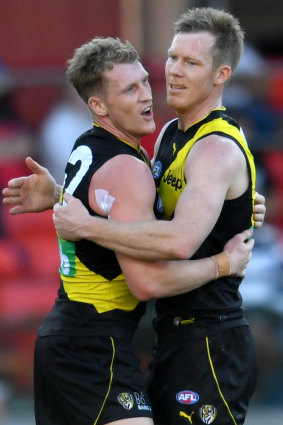 Tigers duo Riewoldt (right) and Caddy had a field day, kicking 14 goals between them.