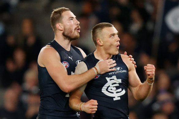 On song: Carlton’s Harry McKay, left, and Patrick Cripps celebrate. 