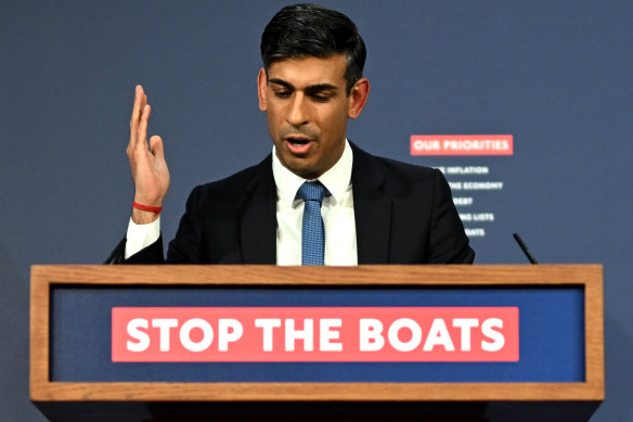 British Prime Minister Rishi Sunak speaks from his “Stop the boats” lectern.