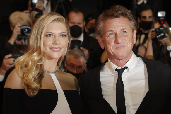Leila George and Sean Penn pose for photographers at the Cannes film festival on July 10, 2021. 