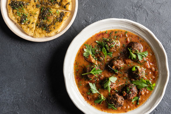 Maha’s “bowl of goodness”, featuring creamy navy beans, burnt tomatoes, winter vegetables and wagyu meatballs with freshly baked bread.